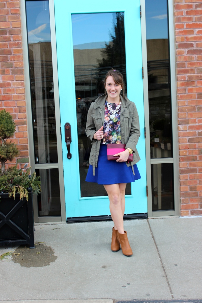 green-utility-jacket-with-skirt-and-floral-blouse-and-ankle-boots