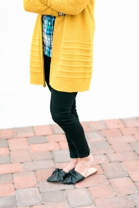 Old Navy Rockstar black skinny jeans with Zara Bow Leather Slides and mustard cardigan