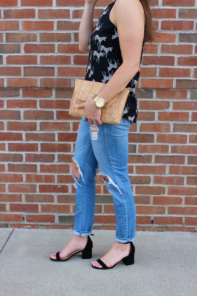 Old Navy Zebra Print Tank top with distressed jeans, cork envelope clutch and black heeled sandals