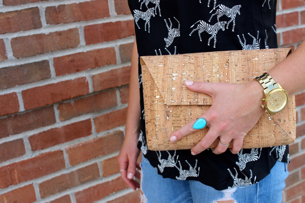 Old Navy Zebra Print Tank top with distressed jeans, cork envelope clutch and black heeled sandals