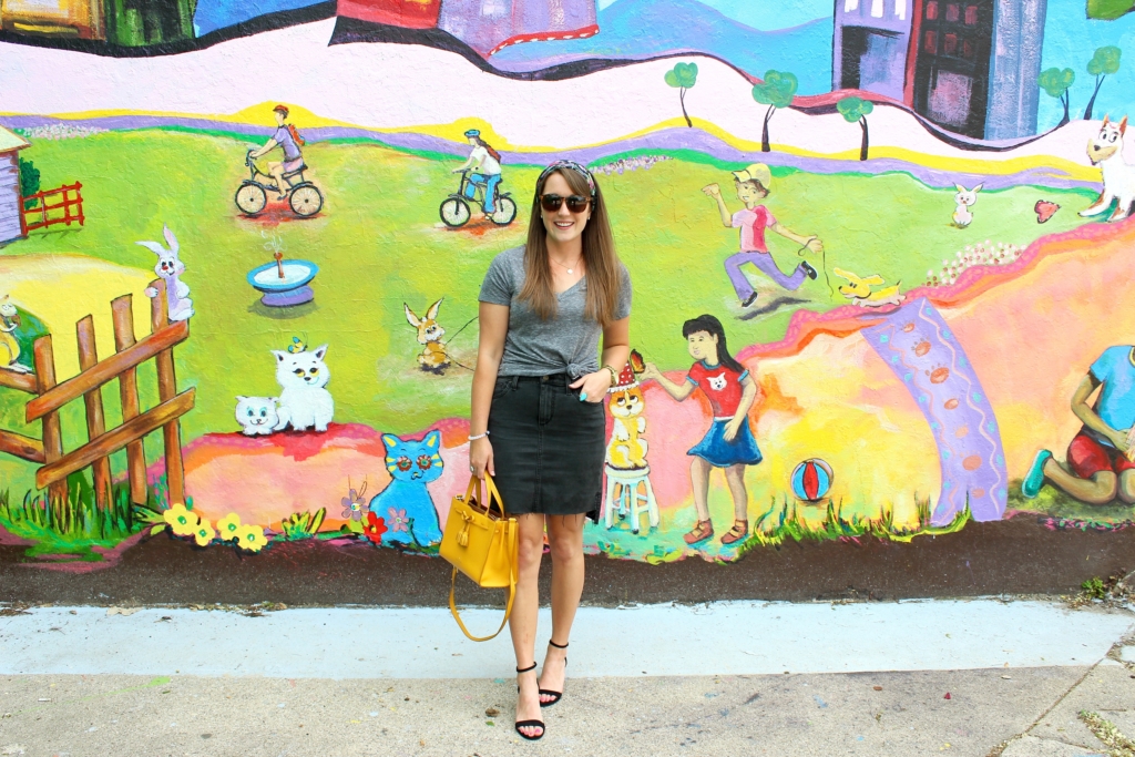 Black denim pencil skirt with gray vneck t shirt and yellow Kate Spade purse