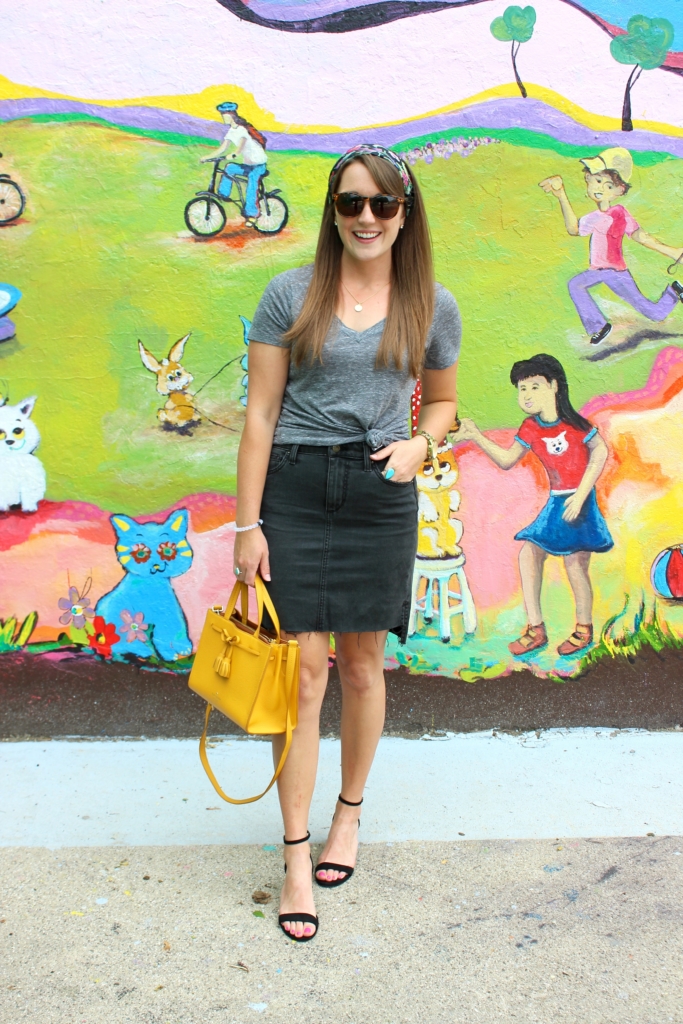 Black denim pencil skirt with gray vneck t shirt and yellow Kate Spade purse