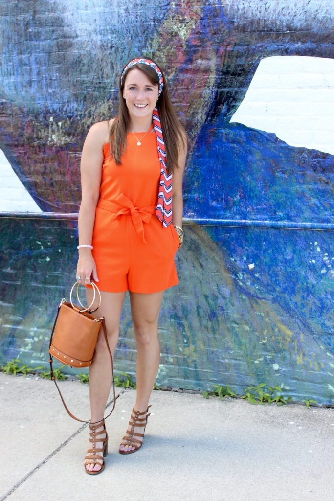 Victoria Beckham Orange Romper with Studded Sandals, Ring Handle Purse and scarf