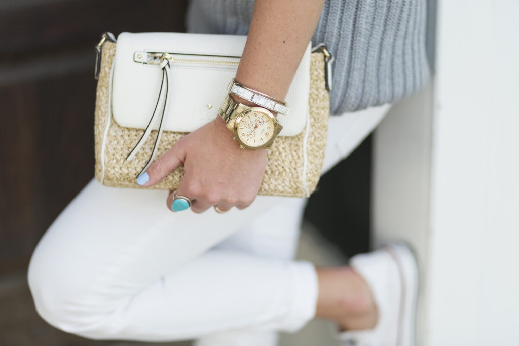 Sleeveless Gap sweater with white jeans, kate spade clutch and converse