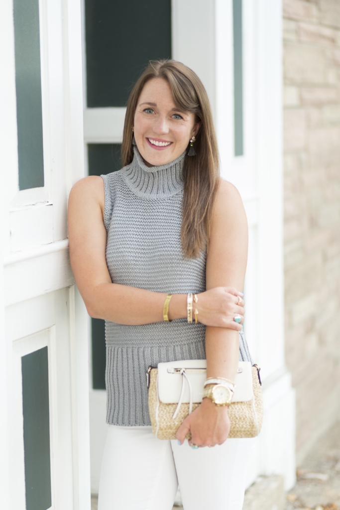 Sleeveless Gap sweater with white jeans, kate spade clutch and converse