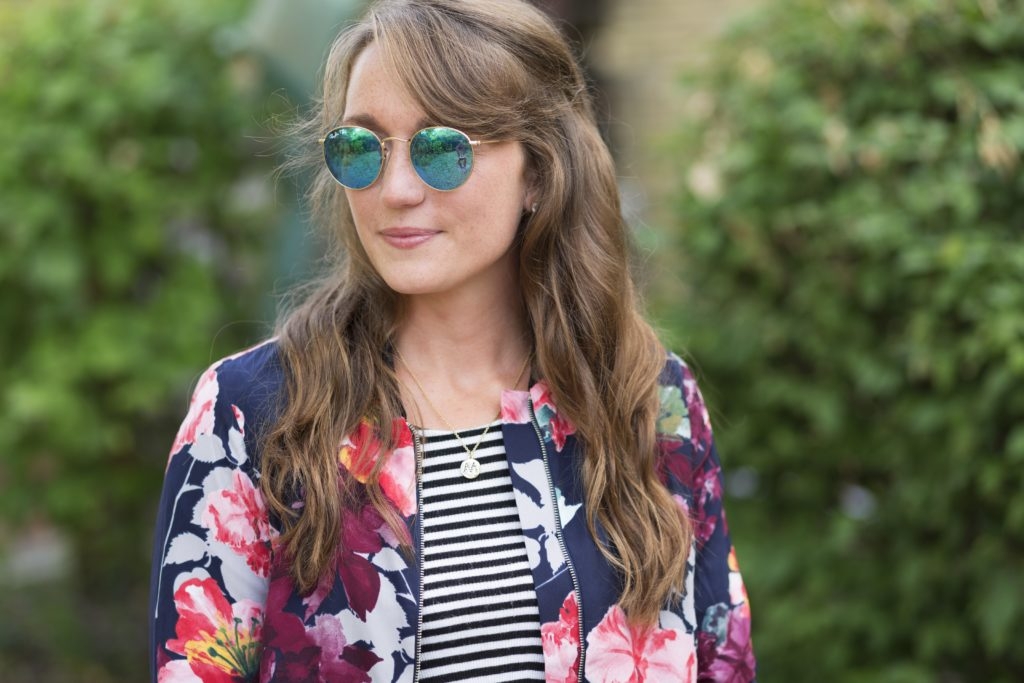 striped tank top with floral bomber and reflective round ray bans