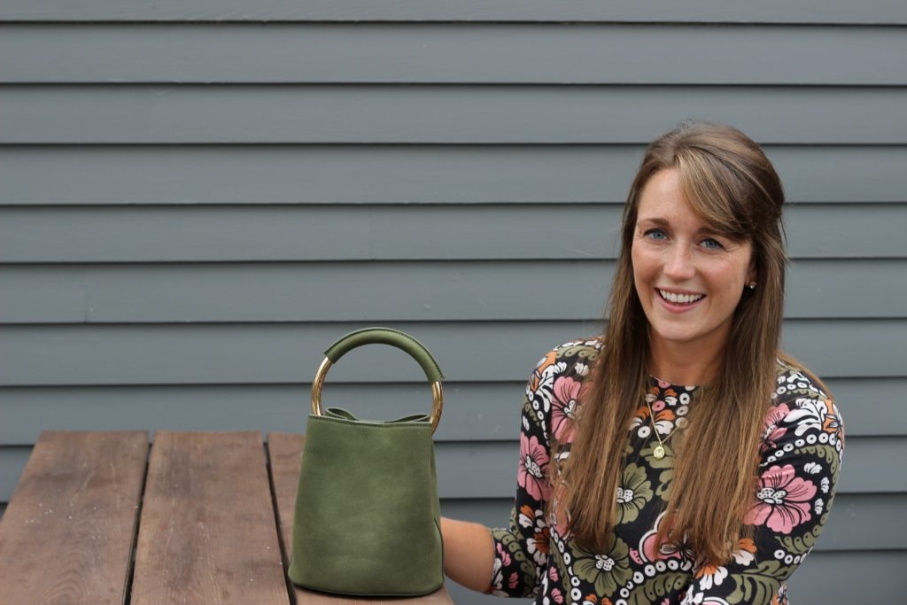 H&M fall floral dress with leather ankle boots and green bucket bag