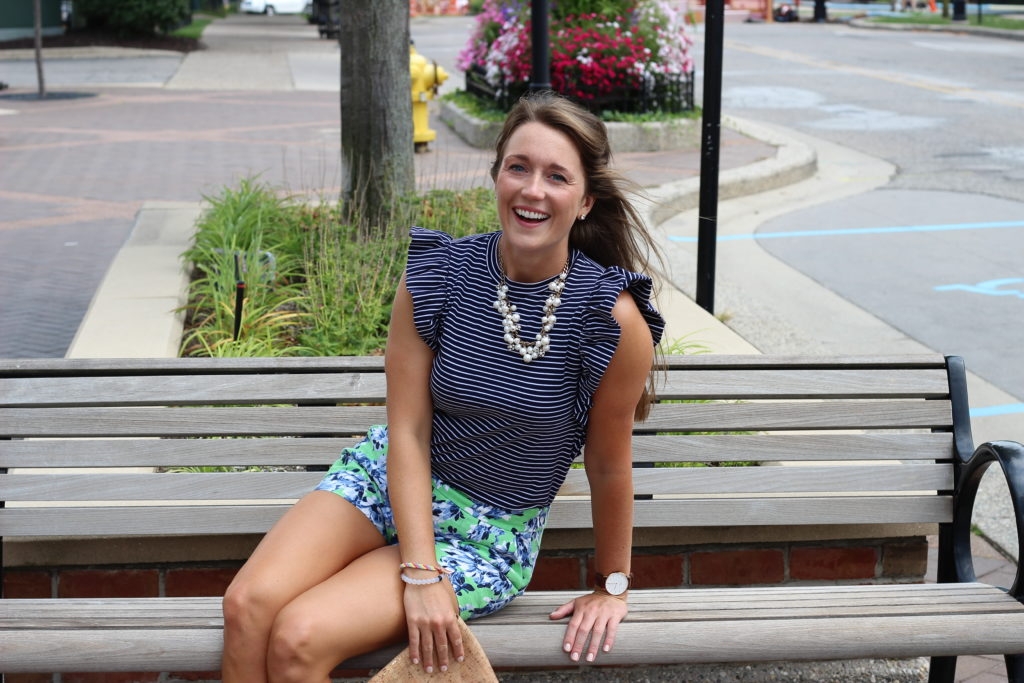 Green floral shorts with striped ruffled top and Converse sneakers