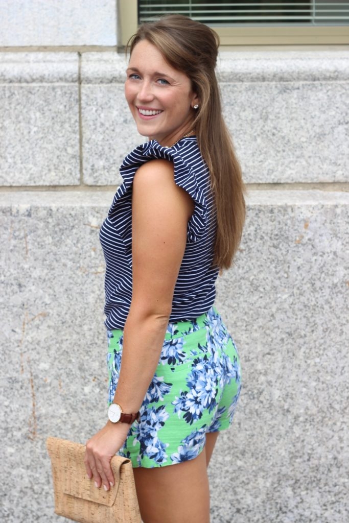 Green floral shorts with striped ruffled top and Converse sneakers