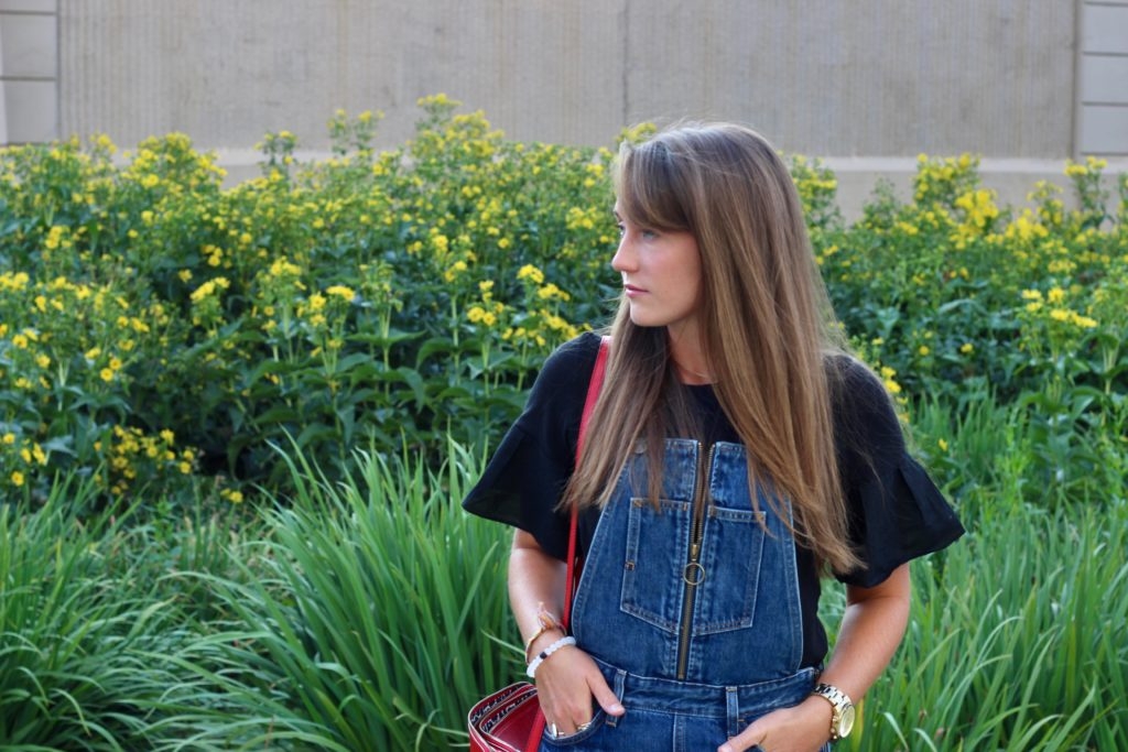 Levi's overalls with Black tee, leopard mules and red crossbody purse