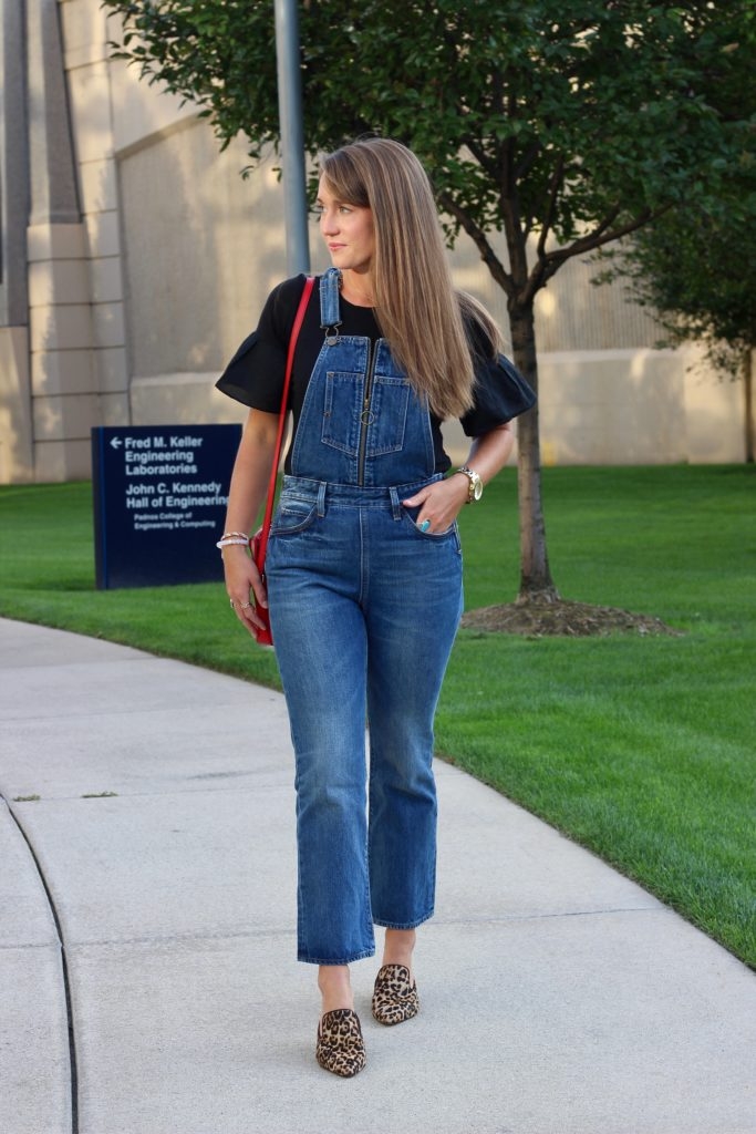 Levis overalls with black ruffle sleeve tee and leopard mules