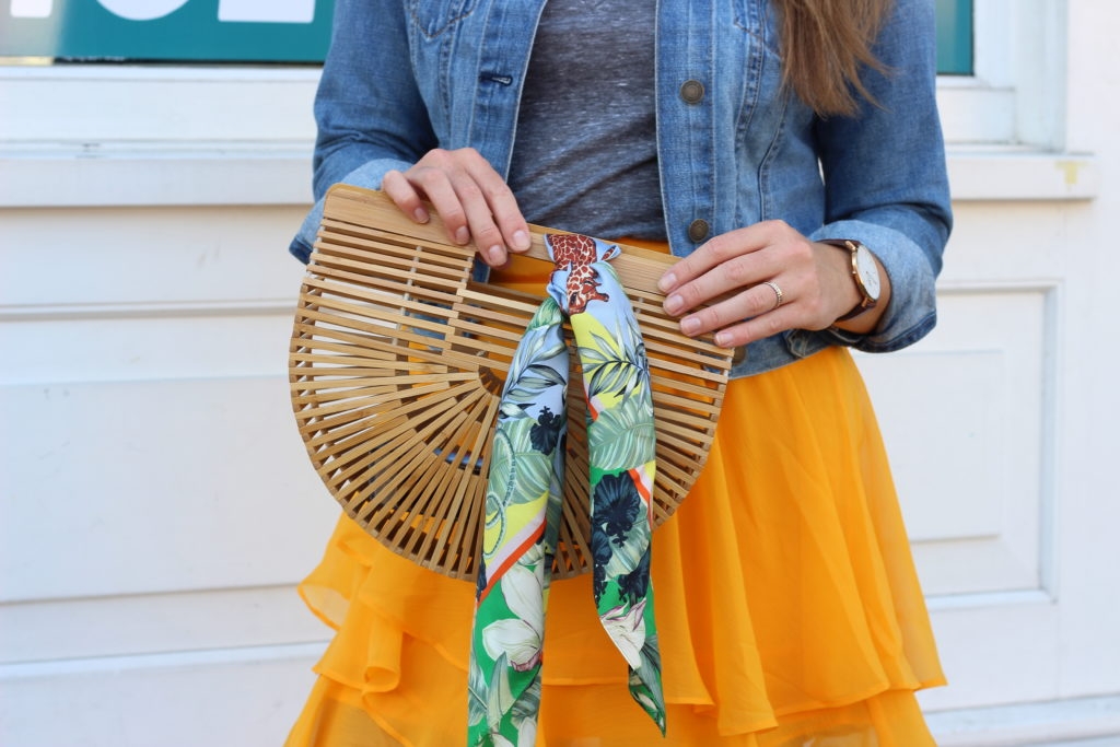 yellow ruffle asos skirt with gray tee and denim jacket