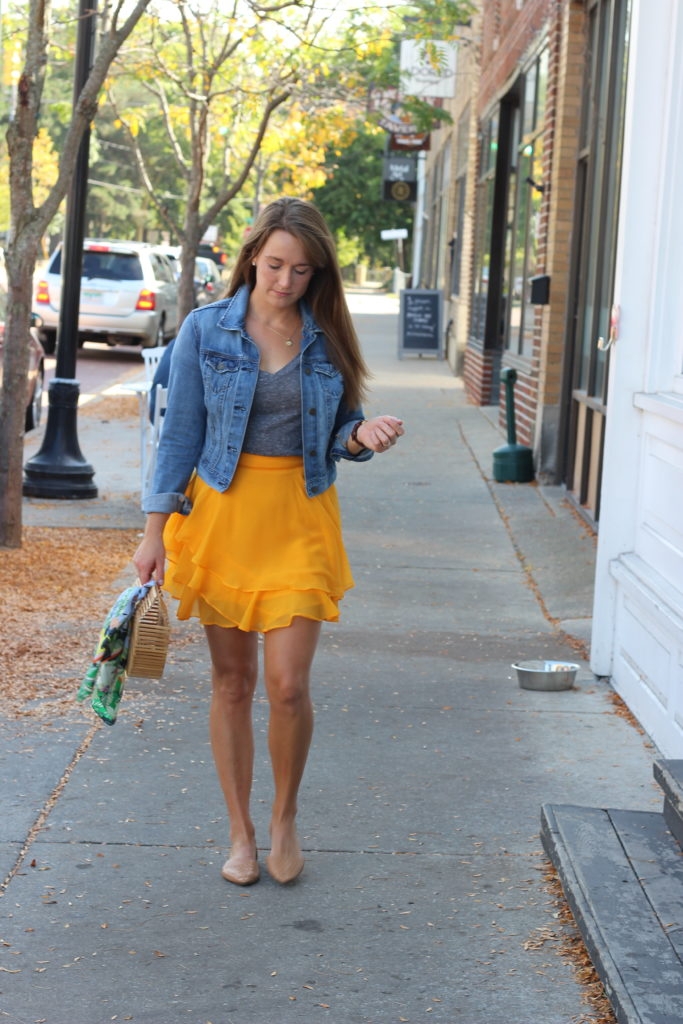 mustard yellow ruffled ASOS skirt with gray v-neck tee and denim jacket