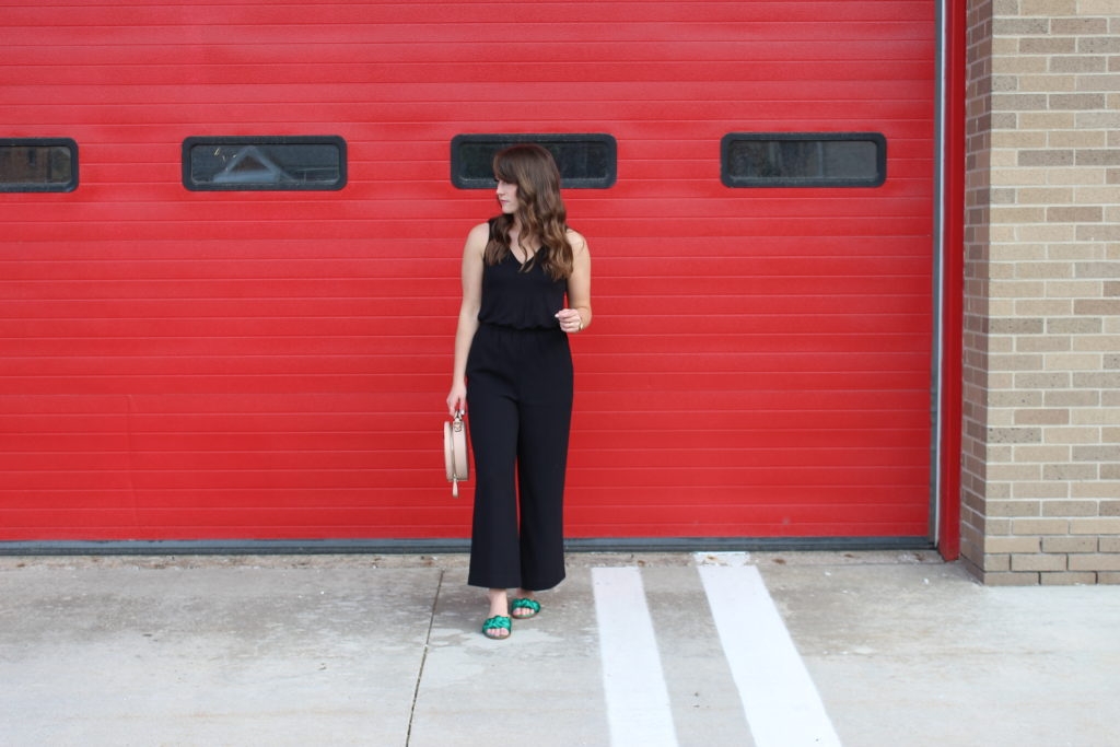 loft black jumpsuit with green sandals and zara purse