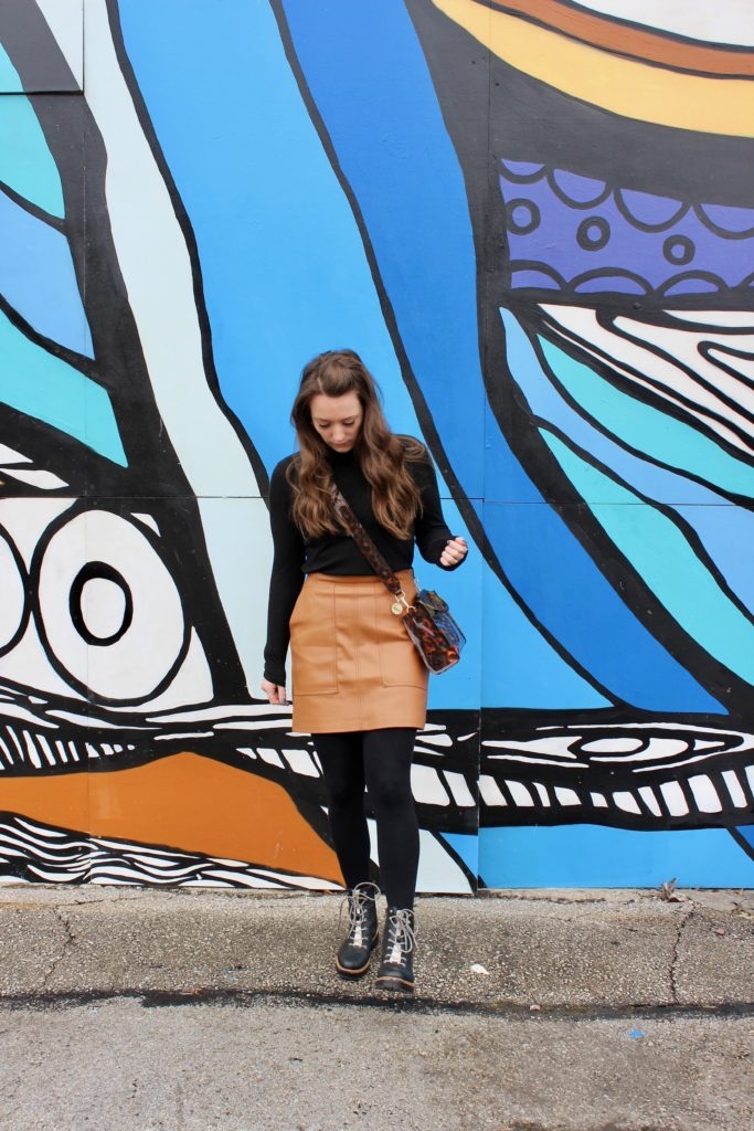 Simple winter style with a turtleneck and camel skirt on Cassidy Lou