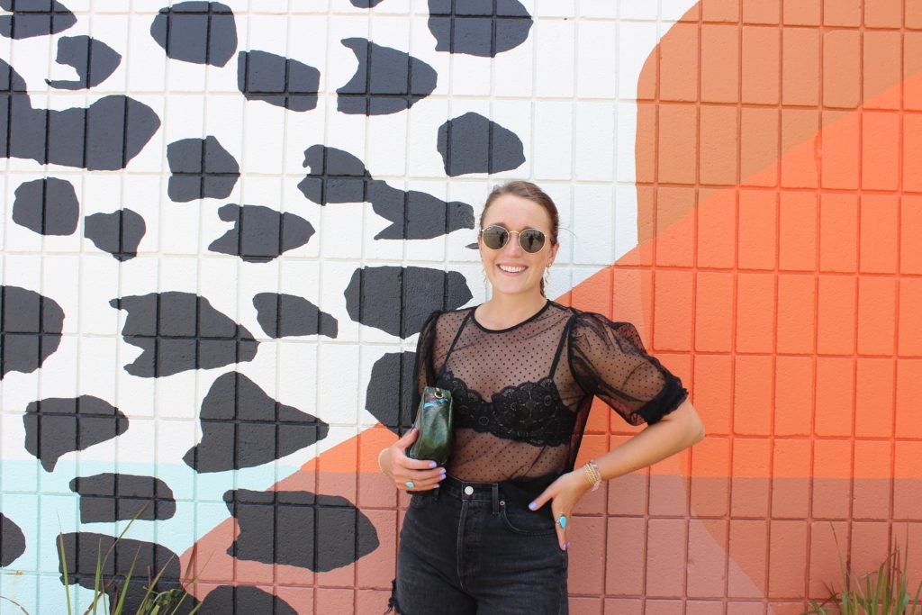 mesh black top with AGOLDE black denim shorts on Cassidy Lou