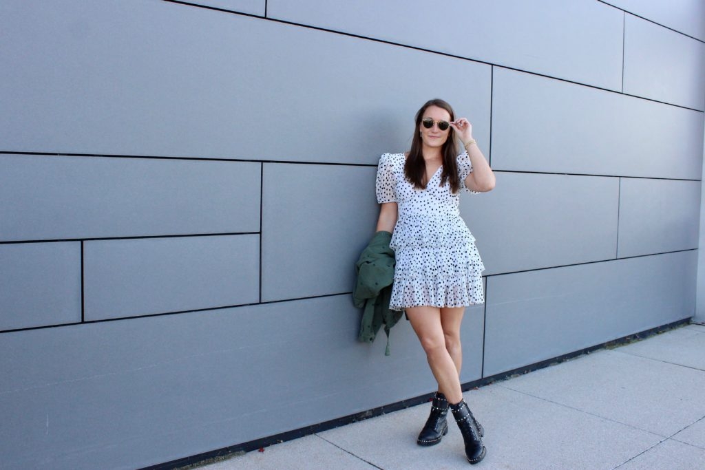 white mini dress styled with combat boots on Cassidy Lou